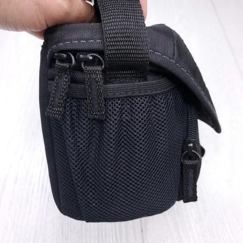 Sony black camera bag. Durable material. Secure strap and buckle. NWOT